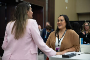 Picture of Jess Lenouvel Talking to one of her TLL event participants