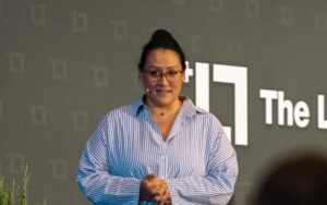 Picture of Jess Lenouvel On the Stage in One of Her Listings Lab Live Events | AI for Real Estate Agents